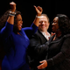 OWN’s Oprah Winfrey reacts as television producer and writer Shonda Rhimes gets up to receive her W.E.B. Du Bois Medal as Weinstein Co. Co-Chairman Harvey Weinstein looks on during the Hutchins Center Honors W.E.B. Du Bois Medal Ceremony in Cambridge, Mass., on Sept. 30, 2014.
Jessica Rinaldi/The Boston Globe via Getty images